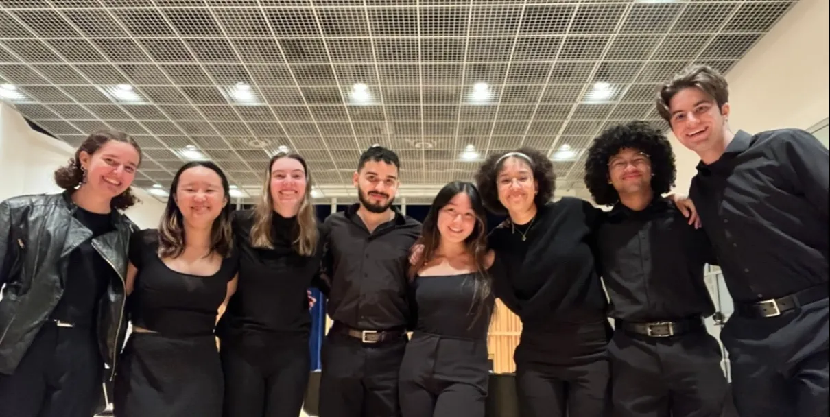 CUWE members smile for the camera at a post-concert social event.