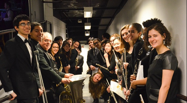 CUWE members line up down the hallway and pose for a picture.