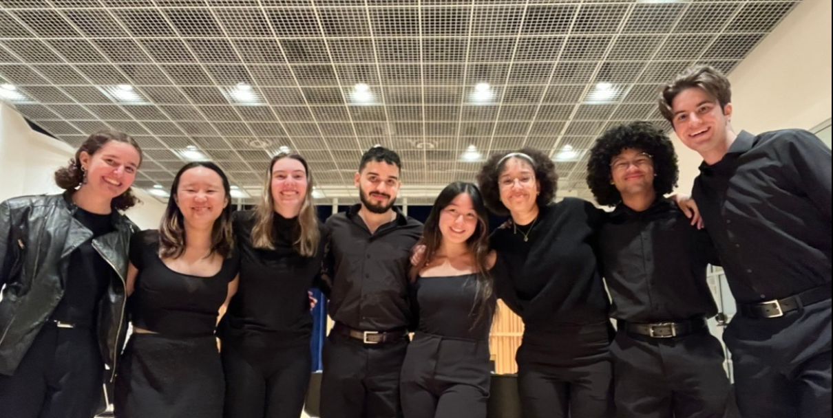 CUWE members smile for the camera at a post-concert social event.