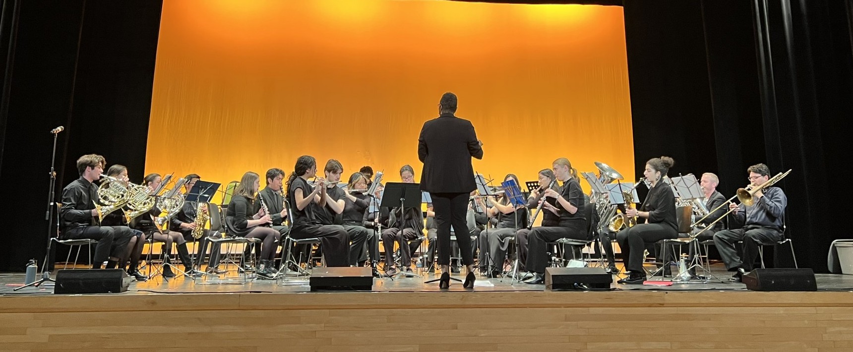 CUWE performs on stage in Columbia's Roone Auditorium